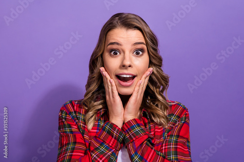 Close-up portrait of her she nice attractive amazed cheerful cheery pretty girl wearing checked shirt good news isolated over bright vivid shine vibrant lilac violet purple color background
