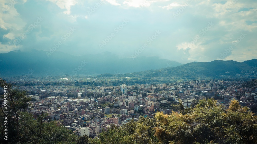 City view with cloudy scenery of mountain