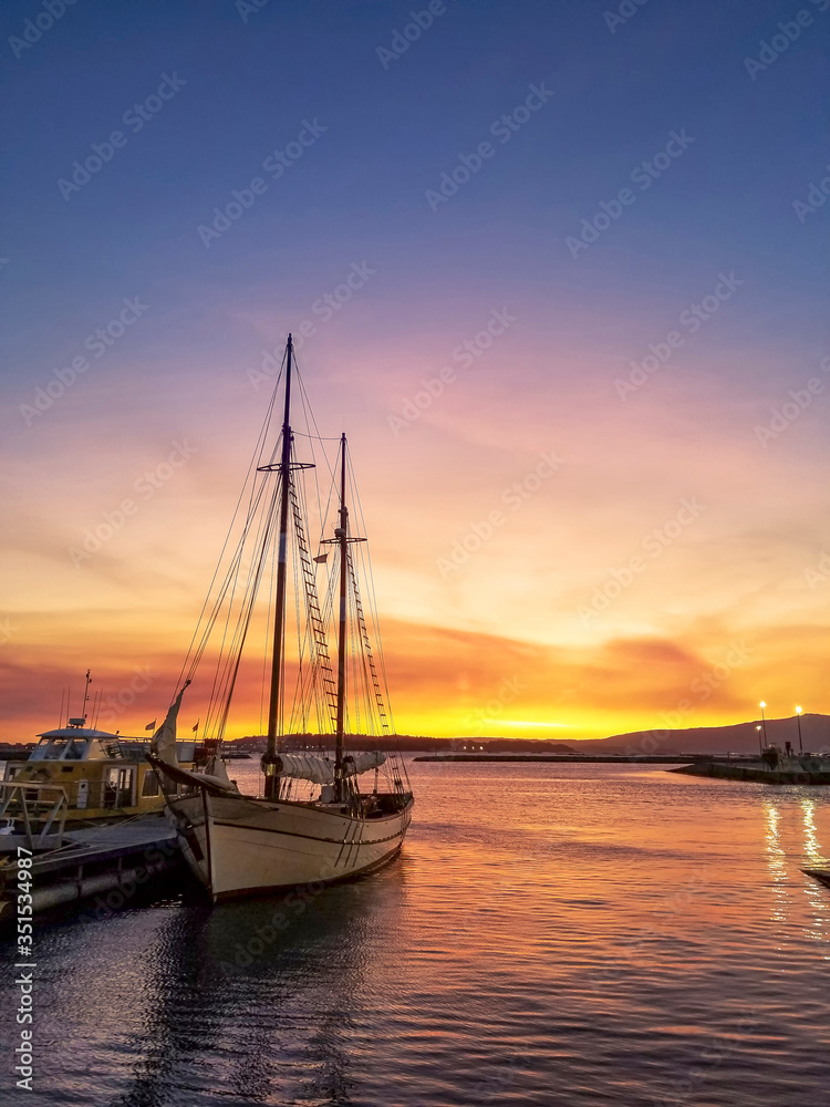 Moored sailboat at dusk