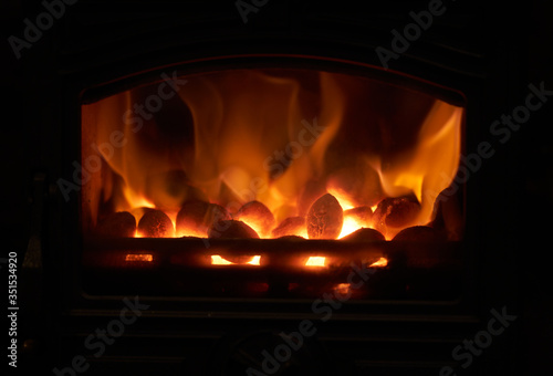 A closeup of smokeless fuel burning in a multifuel stove.