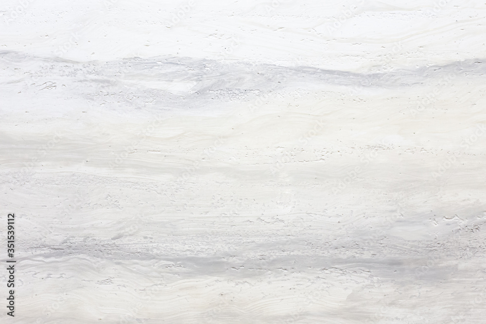 Light grey decorative stone background with wavy pattern Light grey decorative stone background with wavy pattern