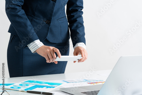 Businesswoman doing photo of document photo