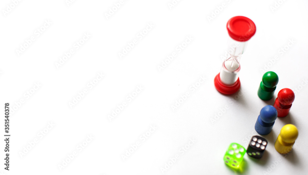 Game cubes, chips, hourglass on a white background. T Game cubes, chips, hourglass on a white background. T