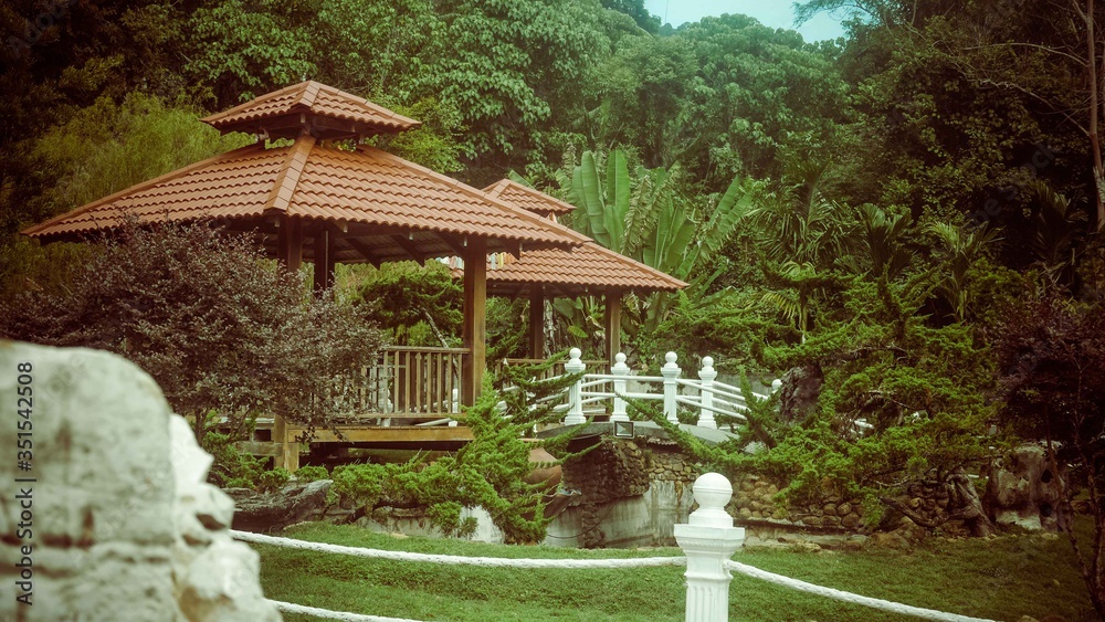 small resting opened hut with red roofs