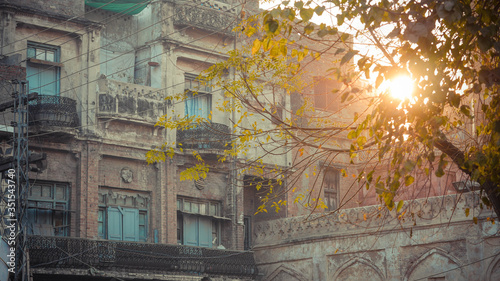 Sun luminates with brick buildings with bridge photo