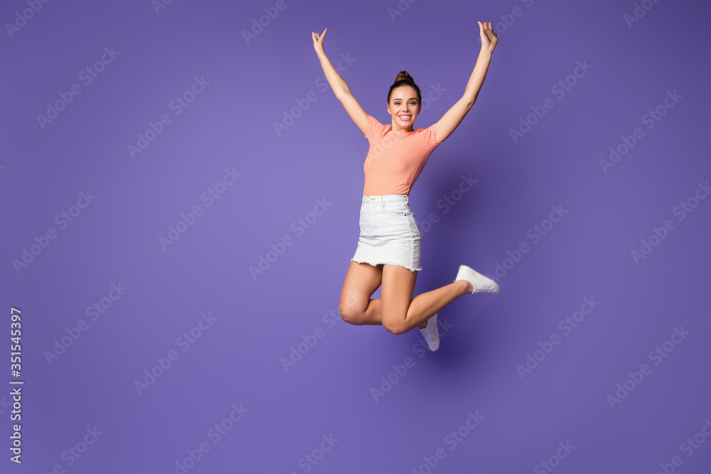 Full length photo of pretty girlish nice youth jump enjoy spring weekend holiday wear good look clothes sneakers isolated over bright color background
