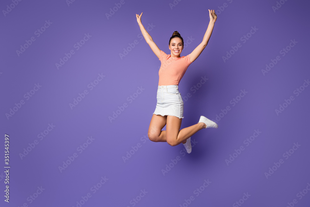 Full length photo of pretty girlish nice youth jump enjoy spring weekend holiday wear good look clothes sneakers isolated over bright color background Full length photo of pretty girlish nice youth jump enjoy spring weekend holiday wear good look clothes sneakers isolated over bright color background