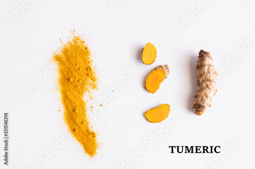 Turmeric root on white background. Tirmeric used as spice and treatment in alternative medicine with multiple benefits for health... photo