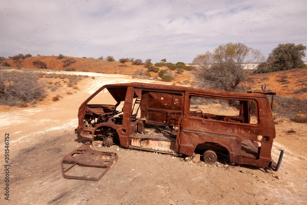Abandoned rusty car wreck in central Australia Abandoned rusty car wreck in central Australia
