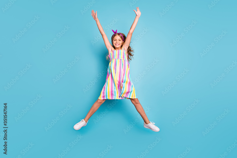 Full length body size view of her she nice attractive lovely pretty glad cheerful cheery girl jumping enjoying holiday vacation having fun isolated on bright vivid shine vibrant blue color background