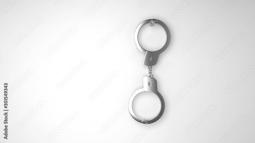 Closed police handcuffs close-up on a white background. Closed police handcuffs close-up on a white background.