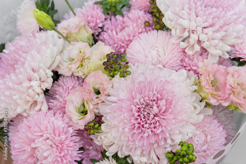 Bouquet of pink chrysanthemums close up. Flower wallpaper. Flower shop.