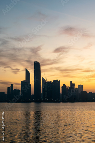 a beautiful sunrise view of Abu Dhabi City from Marina Breakwater Abu Dhabi, UAE, morning, Abu Dhabi sunrise, golden hour © riyas