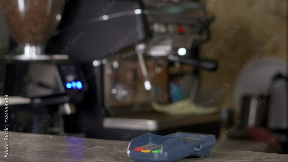 A man cannot pay with cryptocurrency in a coffee shop.