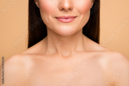 Say no plastic surgery concept. Closeup cropped photo of latin lady presenting natural beauty no makeup showing perfect pouted allure lips isolated beige pastel color background