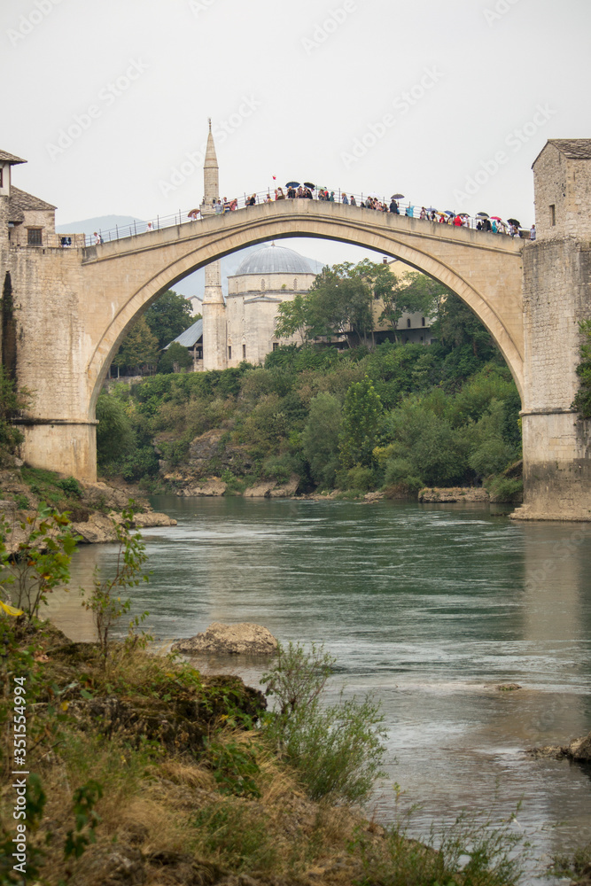 Stari Most, also known as Mostar Bridge, is a rebuilt 16th-century Ottoman bridge in the city of Mostar in Bosnia and Herzegovina that crosses the river Neretva and connects the two parts of the city Stari Most, also known as Mostar Bridge, is a rebuilt 16th-century Ottoman bridge in the city of Mostar in Bosnia and Herzegovina that crosses the river Neretva and connects the two parts of the city