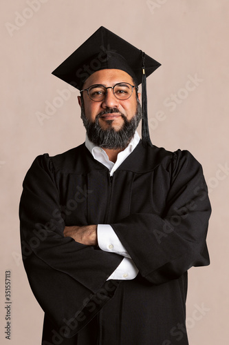 Proud senior man in a graduation gown mockup
