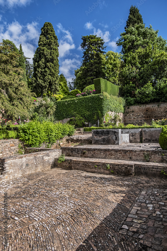 Beautiful garden with fountain in Granada Alhambra. Granada, Andalusia, Spain.