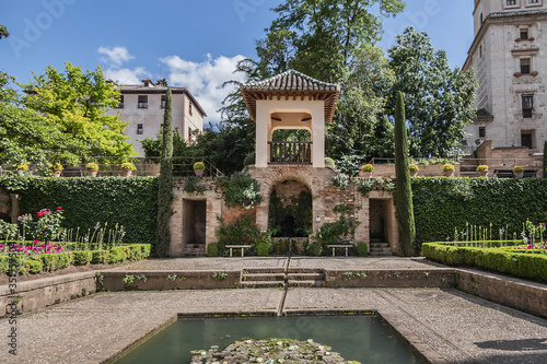 Beautiful garden with fountain in Granada Alhambra. Granada, Andalusia, Spain.