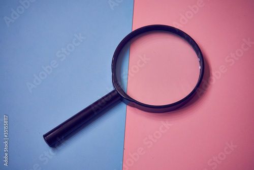 magnifying glass on paper background