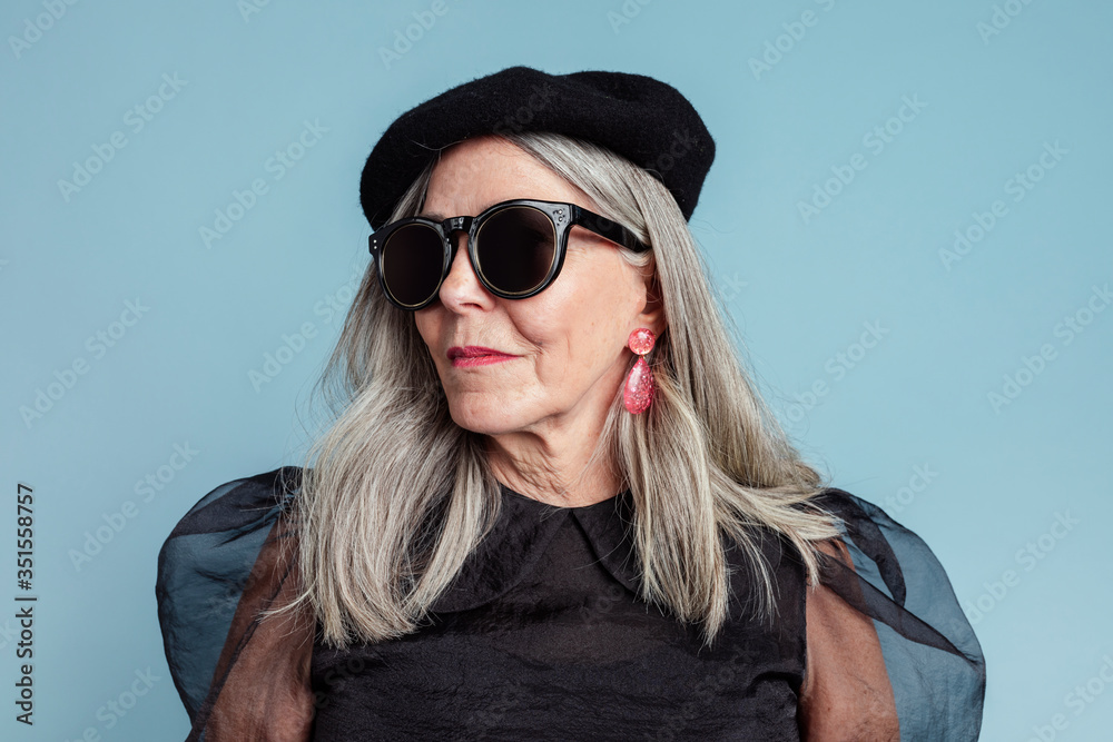 Cool grandma with an attitude in a beret and sunglasses Cool grandma with an attitude in a beret and sunglasses
