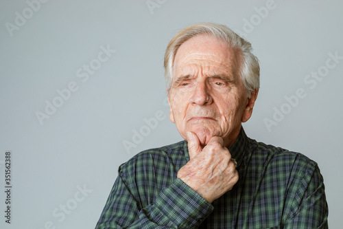 Bild auf Leinwand Senior man with white hair thinking