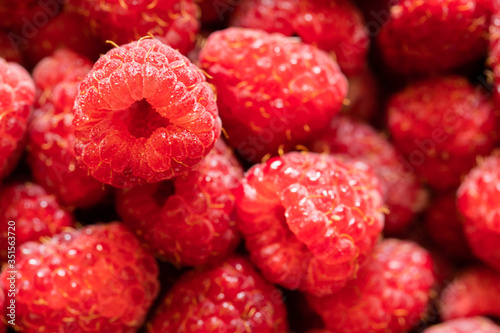 raspberries with water drops close up, selective focus, macro