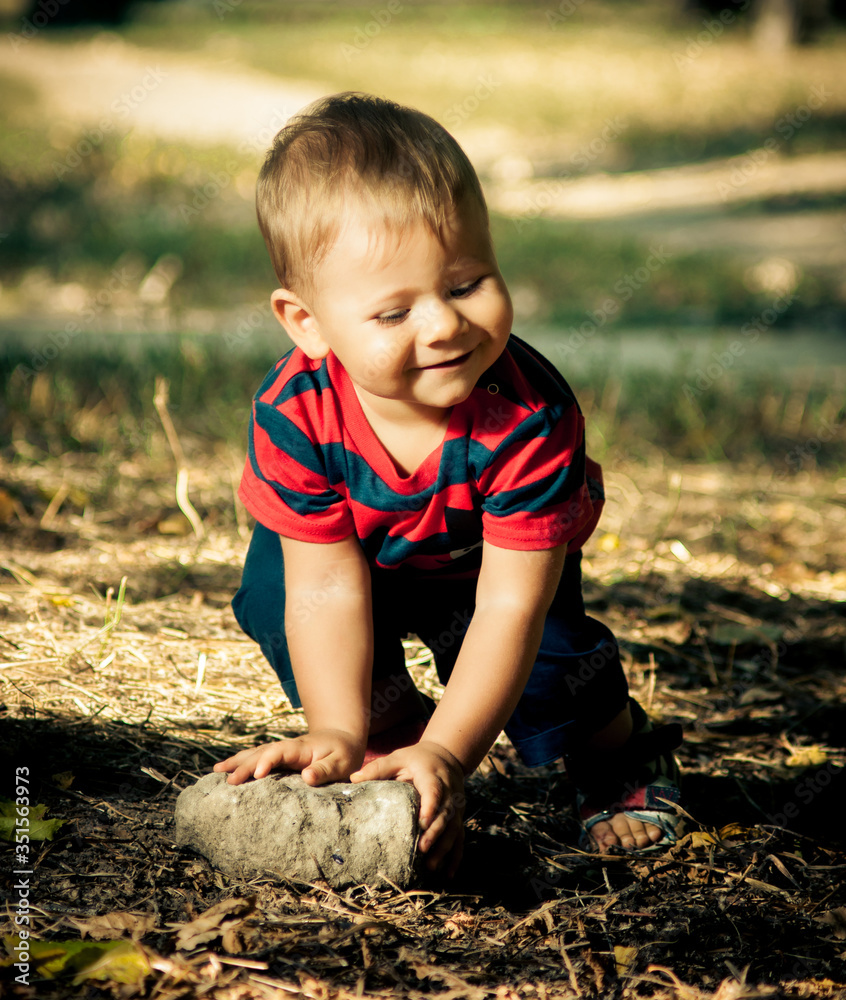 a little boy fell on the grass a little boy fell on the grass