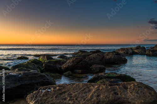 Rocky Sunrise Seascape at the Beach © Merrillie