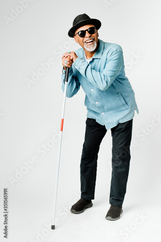 Tablou canvas Blind senior man with a cane walking