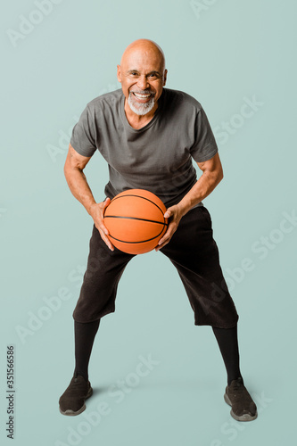 Retired man playing a basketball mockup © rawpixel.com