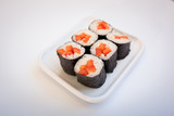  sushi in a plate on a white background