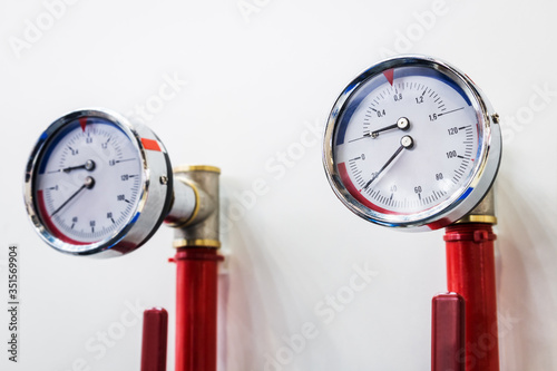 high pressure gauges installed on a water or gas system. Selective focus