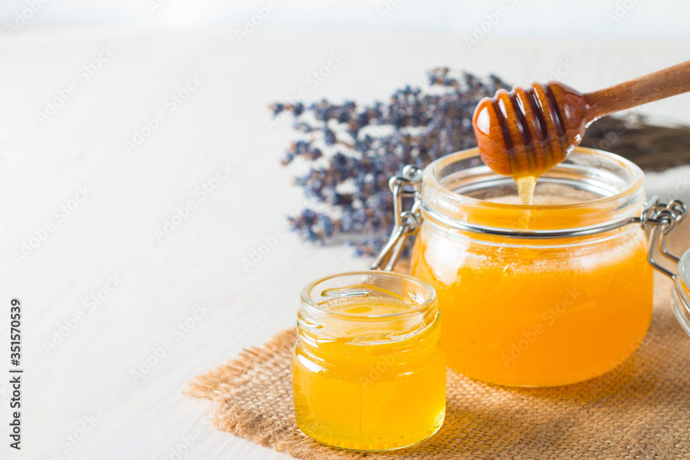 honey dipper and honeycomb. nuts and apples with honey and nuts of various kinds honey dipper and honeycomb. nuts and apples with honey and nuts of various kinds