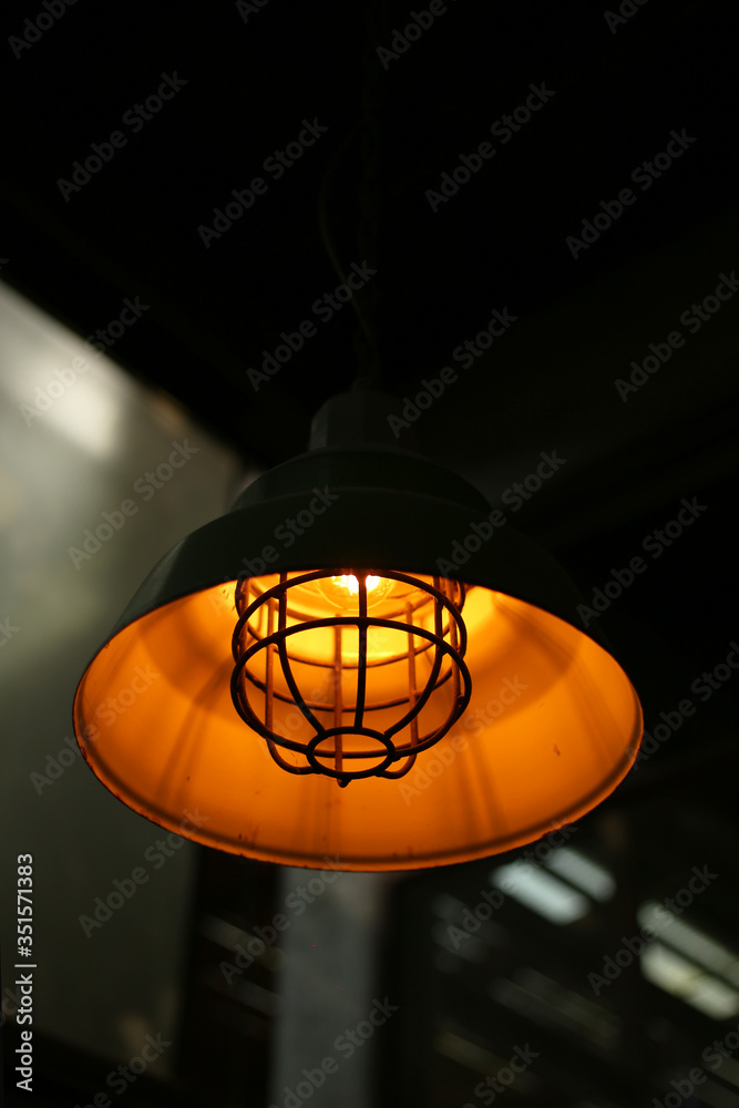 Lamps hanging from the ceiling with orange lights