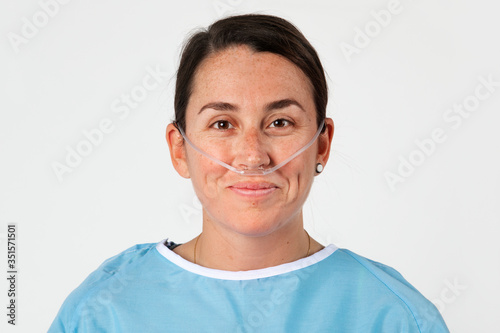 Sick female patient with a nasal cannula photo
