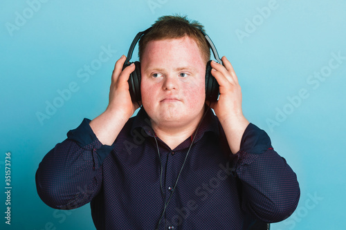 Cool young man with Down Syndrome listening to a sport podcast