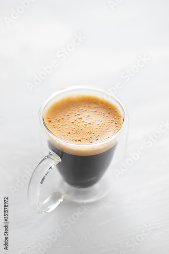 a cup of coffee on ceramic background