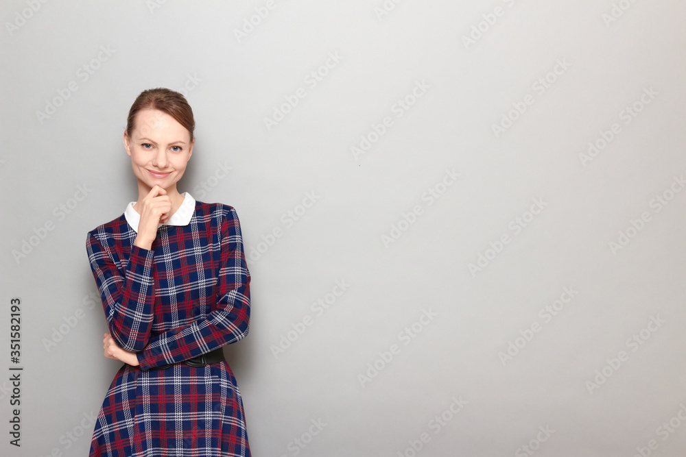 Portrait of happy girl touching chin with hand and smiling Portrait of happy girl touching chin with hand and smiling