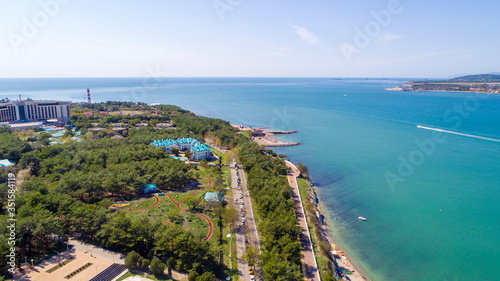 Residential multi-storey complex on the shore of Gelendzhik Bay, Gelendzhik resort on a clear Sunny day. From a bird's eye view