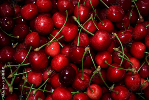 red ripe sweet cherries background, pattern.