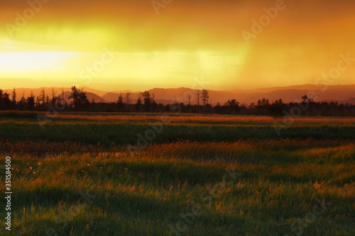 stunningly beautiful sunset with bright colors on a lake in Kyrgyzstan. Travel and nature