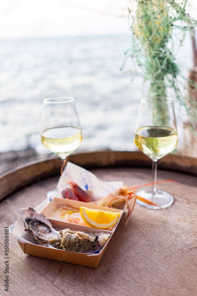 Delicious seafood facing italian sea apulia wine glasses