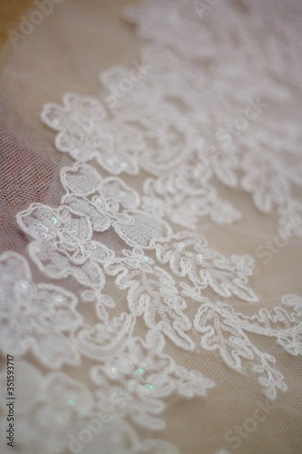 Lace and embroidery with beads on fabric