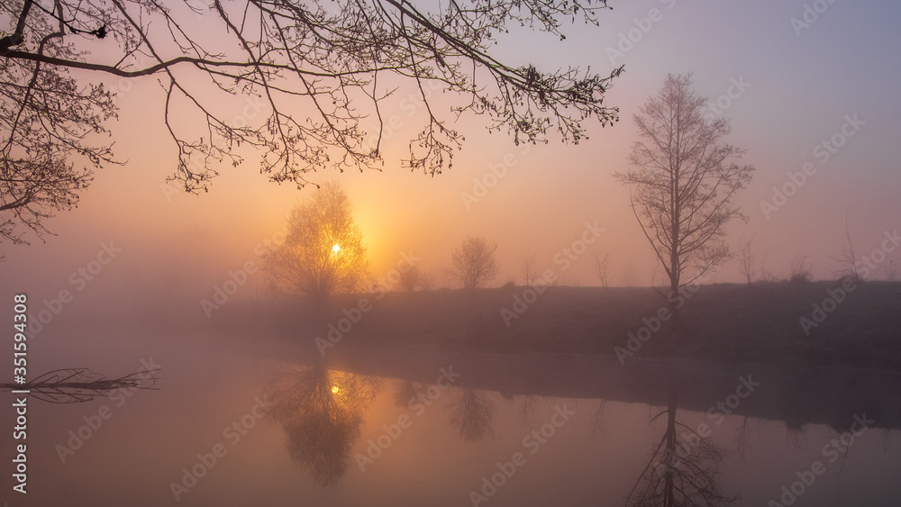 
foggy sunrise on the lake