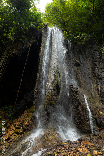 View of the fresh  noisy and intense water in Tumpak Sewu Waterfall  in East Java  Indonesia.