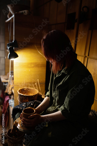 The master works on a Potter's wheel.