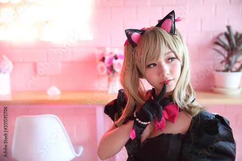 Japan anime cosplay , portrait of girl cosplay in pink room background