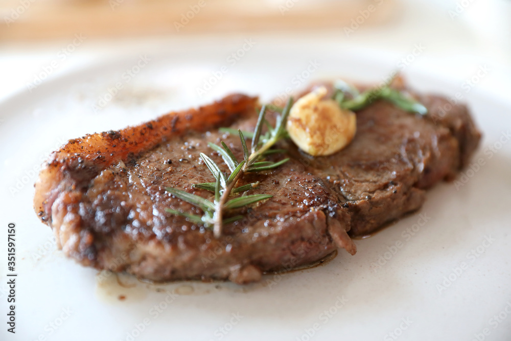 beef steak with salad on white table beef steak with salad on white table