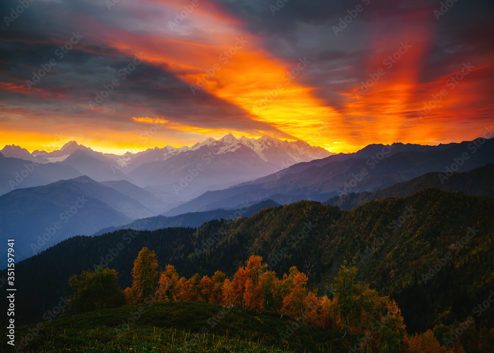 Fantastic brilliant sunrise with rays breaking through the clouds. Location place of  Upper Svaneti, Georgia country.
